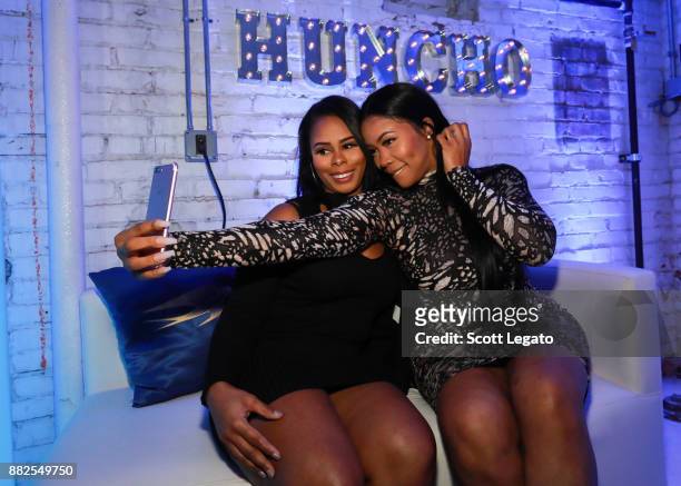Radio personality Deelishis takes a selfie with guest at the H.O.M.E. By Martell event on November 29, 2017 in Detroit, Michigan.