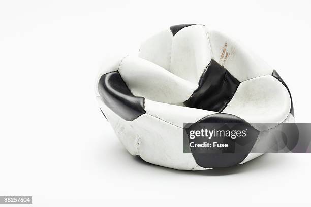 flat soccer ball - deflated stock-fotos und bilder