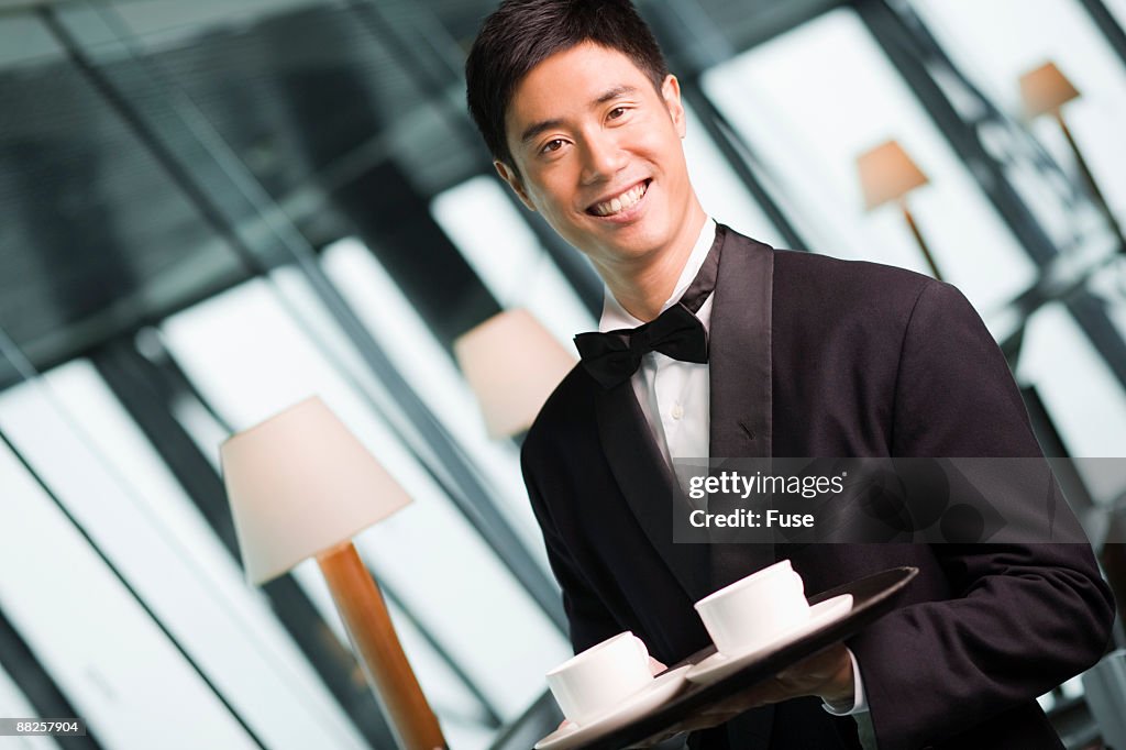 Waiter Serving Coffee at Fine Restaurant