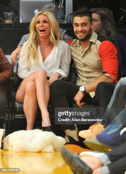 Britney Spears and Sam Asghari attend a basketball game between the Los Angeles Lakers and the Golden State Warriors at Staples Center on November...