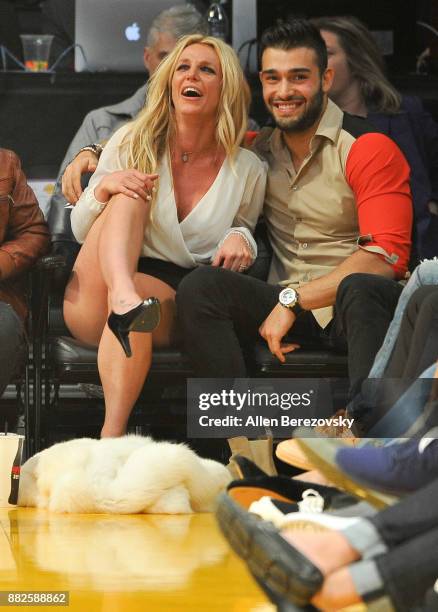 Britney Spears and Sam Asghari attend a basketball game between the Los Angeles Lakers and the Golden State Warriors at Staples Center on November...