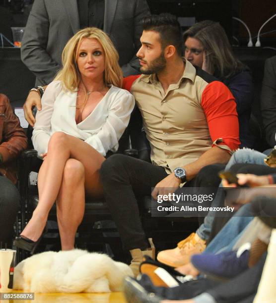 Britney Spears and Sam Asghari attend a basketball game between the Los Angeles Lakers and the Golden State Warriors at Staples Center on November...