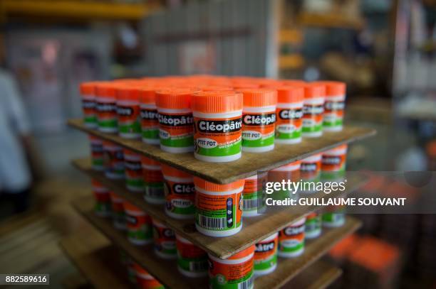 This photograph taken on November 28 shows a cluster of Cléopâtre glue "ptit pots" at the company's manufacturing plant at Ballan-Mire in central...