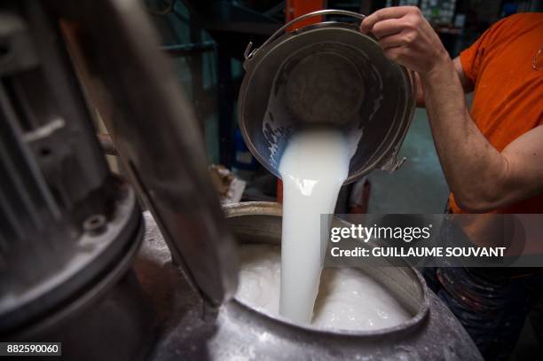 This photograph taken on November 28 shows the manufacturing process of Cléopâtre glue at the company's plant at Ballan-Mire in central France.