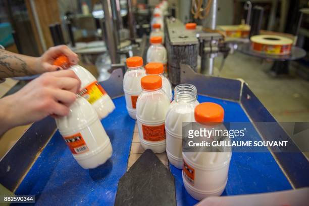 This photograph taken on November 28 shows Cléopâtre glue on the production line at the company's manufacturing plant at Ballan-Mire in central...