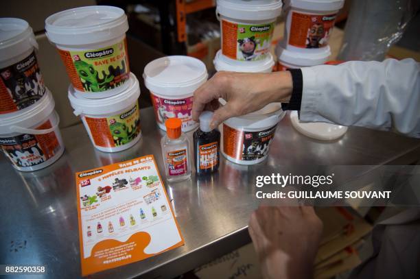 This photograph taken on November 28 shows a stack of Cléopâtre "Slime" jars at the company's glue plant at Ballan-Mire in central France. / AFP...