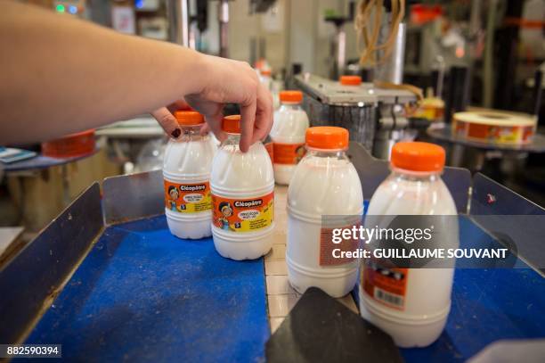 This photograph taken on November 28 shows Cléopâtre glue on the production line at the company's manufacturing plant at Ballan-Mire in central...