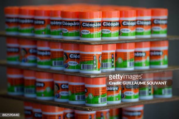 This photograph taken on November 28 shows a cluster of Cléopâtre glue "ptit pot" at the company's manufacturing plant at Ballan-Mire in central...