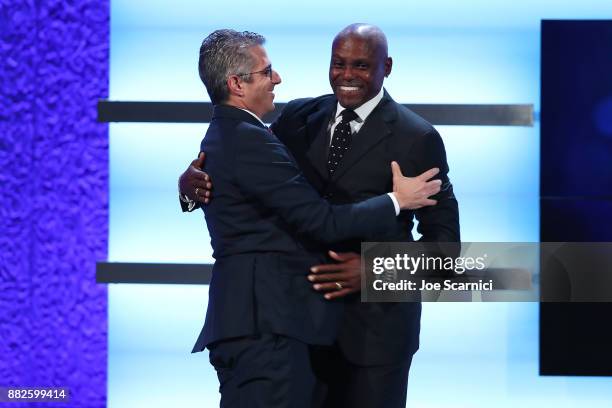 Casey Wasserman and Carl Lewis is seen on stage during the 2017 Team USA Awards on November 29, 2017 in Westwood, California.