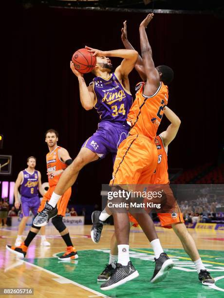 Perry Ellis of the Kings injures his shoulder while driving to the basket during the round eight NBL match between the Sydney Kings and the Cairns...