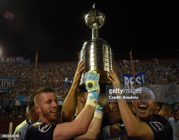 Goalkeepers of Gremio Paulo Victor Vidotti and Marcelo Grohe raise the trophy winning 2 to 1 in Copa Libertadores final match against Lanus at the...