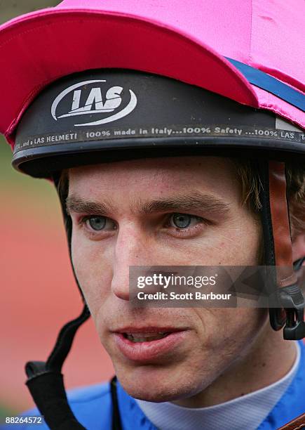 Chris Symons talks to the media after riding Arms Wide Open to win race 2 the Carbine Club Handicap during the Queen's Birthday Weekend meeting at...