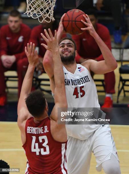 Kameron Rooks of the San Diego State Aztecs takes a shot over Drick Bernstine of the Washington State Cougars the championship game of the Wooden...