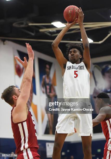 Jalen McDaniels of the San Diego State Aztecs shoots over Jeff Pollard of the Washington State Cougars during the championship game of the Wooden...