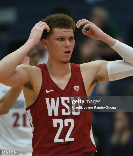 Malachi Flynn of the Washington State Cougars reacts to a foul call during the game against the Diego State Aztecs at the Titan Gym on November 26,...