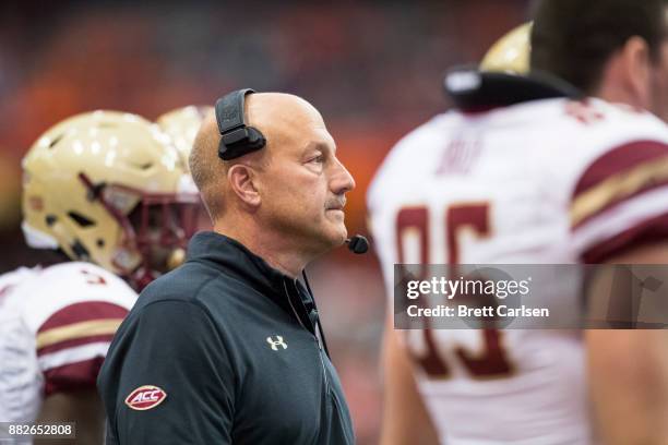 Head coach Steve Addazio of the Boston College Eagles participates in a time out huddle during the game against the Syracuse Orange at the Carrier...