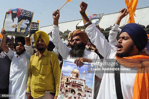 Activists from radical Sikh organizations shout slogans in support of Sikh leader Sant Jarnail Singh Bhindranwale and Khalistan, the name for an...