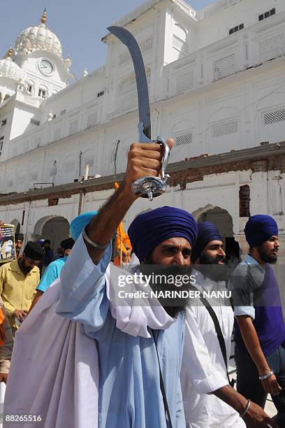 Activists from radical Sikh organizations shout slogans in support of Sikh leader Sant Jarnail Singh Bhindranwale and Khalistan, the name for an...