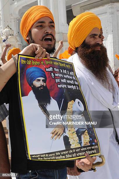 Activists from radical Sikh organizations shout slogans in support of Sikh leader Sant Jarnail Singh Bhindranwale and Khalistan, the name for an...