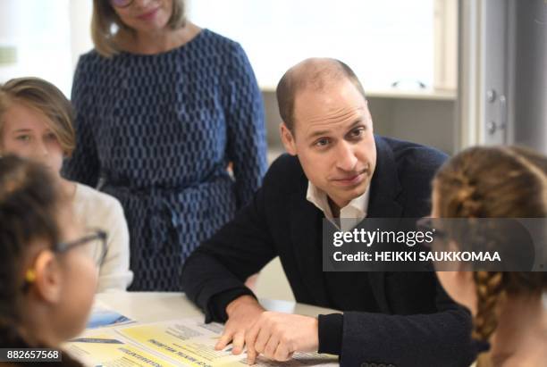 Britain's Prince William, Duke of Cambridge, meets pupils of the Lauttasaari School primary school in Helsinki, Finland, on November 30, 2017. Prince...