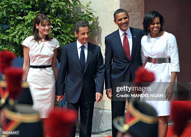 President Barack Obama and First Lady Michelle Obama pose with French President Nicolas Sarkozy and First Lady Carla Bruni-Sarkozy during a welcoming...