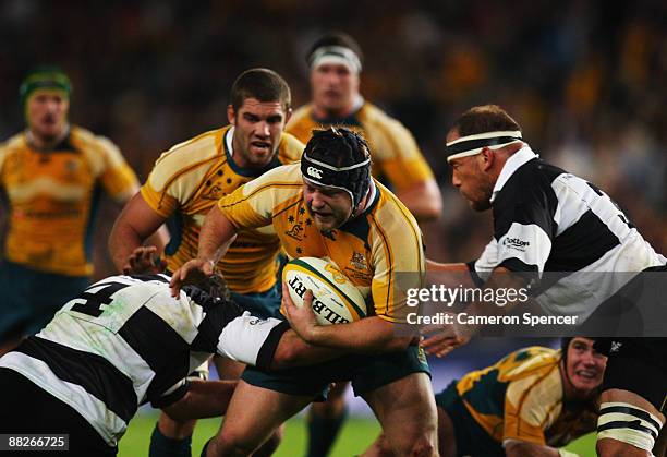 Benn Robinson of the Wallabies runs with the ball during the Nick Shehadie Cup match between the Australian Wallabies and the Barbarians at Sydney...