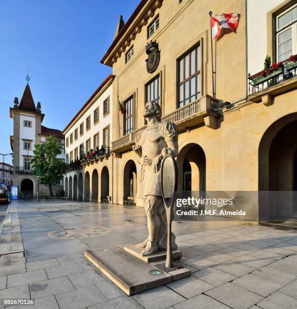 city hall with pero da covilhã statue - covilha stock-fotos und bilder