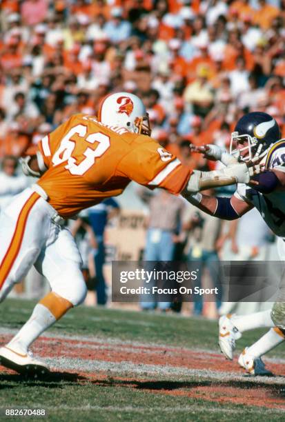 Lee Roy Selmon of the Tampa Bay Buccaneers in action against Steve Riley of the Minnesota Vikings during an NFL football game December 7, 1980 at...