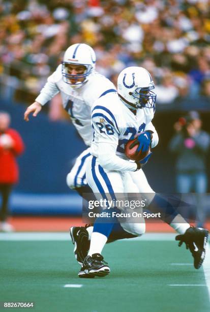 Marshall Faulk of the Indianapolis Colts carries the ball against the Pittsburgh Steelers during the AFC Wild Card game December 29, 1996 at Three...