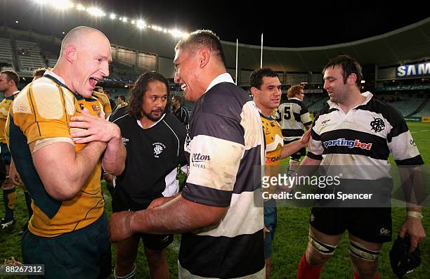 Stirling Mortlock of the Wallabies speaks with Jerry Collins of the Barbarians following the Nick Shehadie Cup match between the Australian Wallabies...