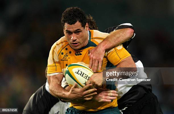 George Smith of the Wallabies is tackled during the Nick Shehadie Cup match between the Australian Wallabies and the Barbarians at Sydney Football...