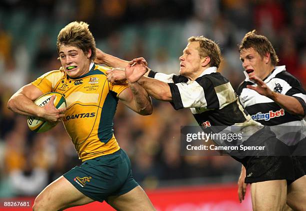 James O'Connor of the Wallabies is tackled during the Nick Shehadie Cup match between the Australian Wallabies and the Barbarians at Sydney Football...