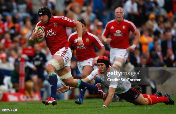 British and Irish Lions forward Stephen Ferris races through to score the opening try during the match between the Cheetahs and the British and Irish...