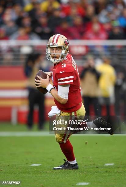 Beathard of the San Francisco 49ers rolls out to pass against the Seattle Seahawks during their NFL football game at Levi's Stadium on November 26,...