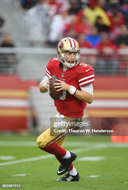 Beathard of the San Francisco 49ers rolls out to pass against the Seattle Seahawks during their NFL football game at Levi's Stadium on November 26,...