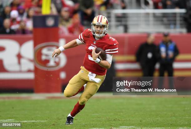 Beathard of the San Francisco 49ers runs with the ball against the Seattle Seahawks during their NFL football game at Levi's Stadium on November 26,...