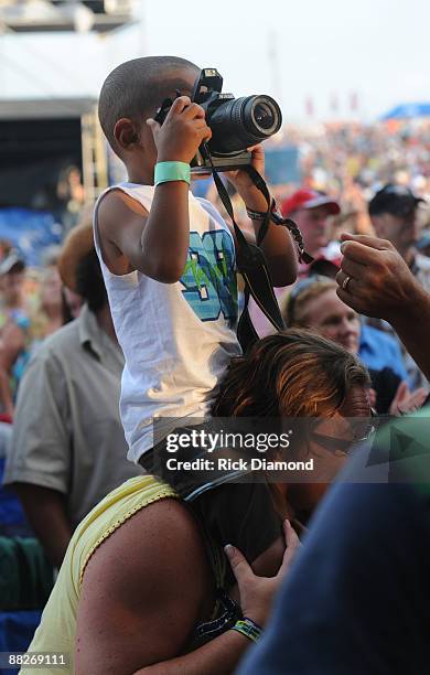 Young fan takes a photo at the 2009 BamaJam Music and Arts Festival on June 5, 2009 in Enterprise, Alabama.