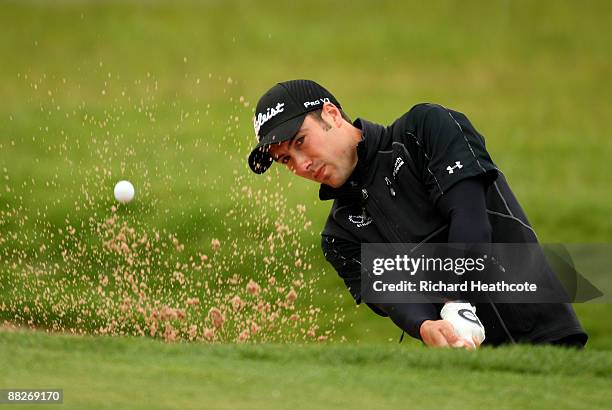 Ross Fisher of England hits a bunker shot on the 1st during the third round of the Celtic Manor Wales Open on the 2010 Course at The Celtic Manor...