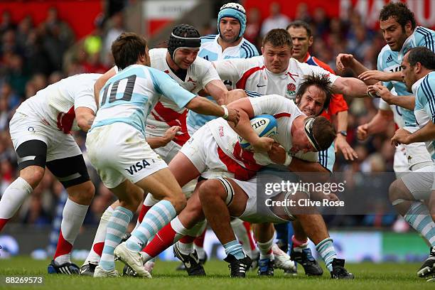 Dyland Hartley of England is tackled during the Standard Bank Cup match between England and Argentina at Old Trafford on June 6, 2009 in Manchester,...