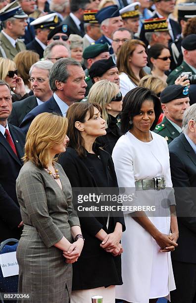 British First Lady Sarah Brown, French First Lady Carla Bruni-Sarkozy and US First Lady Michelle Obama attend on June 6, 2009 in Colleville-sur-Mer...
