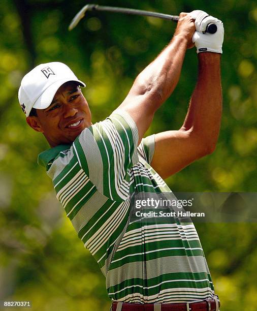 Tiger Woods watches his tee shot on the fourth hole during the third round of the Memorial Tournament at the Muirfield Village Golf Club on June 6,...