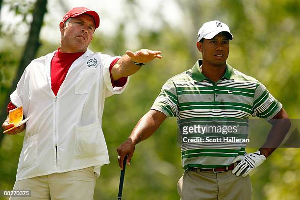 Tiger Woods chats with his caddie Steve Williams on the fifth hole during the third round of the Memorial Tournament at the Muirfield Village Golf...