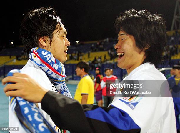 Yasuhito Endo and Shinji Kagawa of Japan celebrate qualifying for the 2010 FIFA World Cup in South Africa after the 2010 FIFA World Cup qualifier...