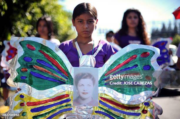 Girl takes part in a march celebrating the International Day for the Elimination of Violence against Women in San Salvador, El Salvador on November...