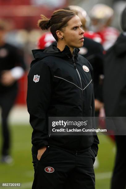 Seasonal Offensive Assistant Coach Katie Sowers looks on during the warm up before the game against the Seattle Seahawks at Levi's Stadium on...