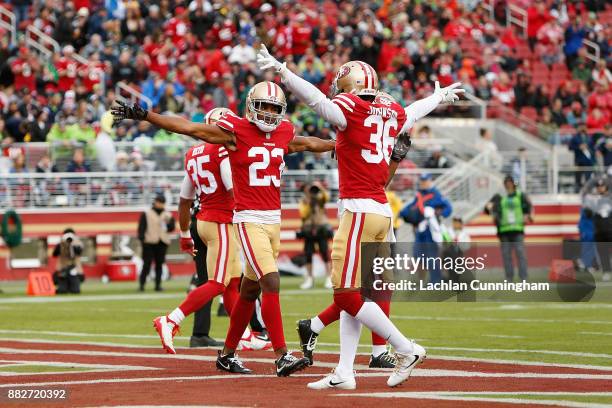 Ahkello Witherspoon of the San Francisco 49ers celebrates with teammate Dontae Johnson after breaking up a pass against the Seattle Seahawks at...