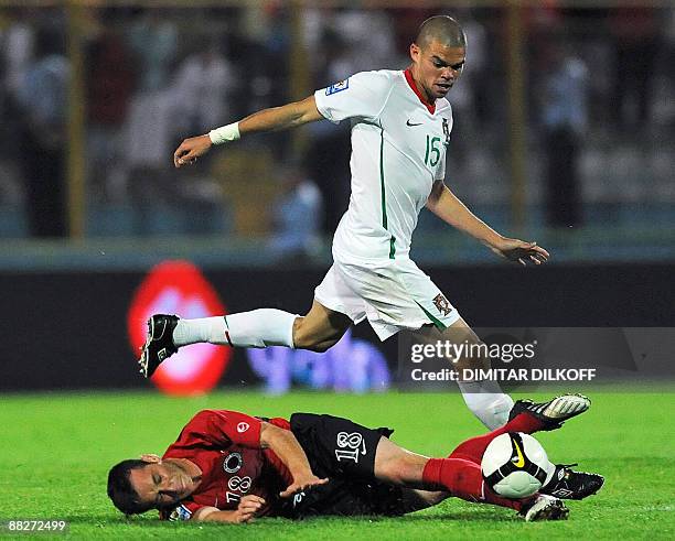Portugal's Pepe vies with Albania's Hamdi Salihi during their 2010 World Cup qualifying football match at the Qemal Stafa stadium on June 6, 2009 in...