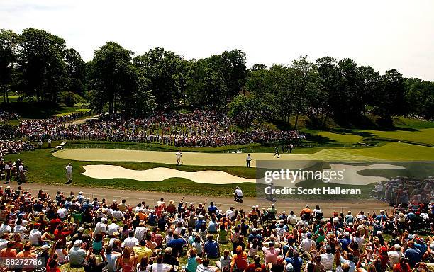General view of the play of Tiger Woods on the 14th green during the third round of the Memorial Tournament at the Muirfield Village Golf Club on...