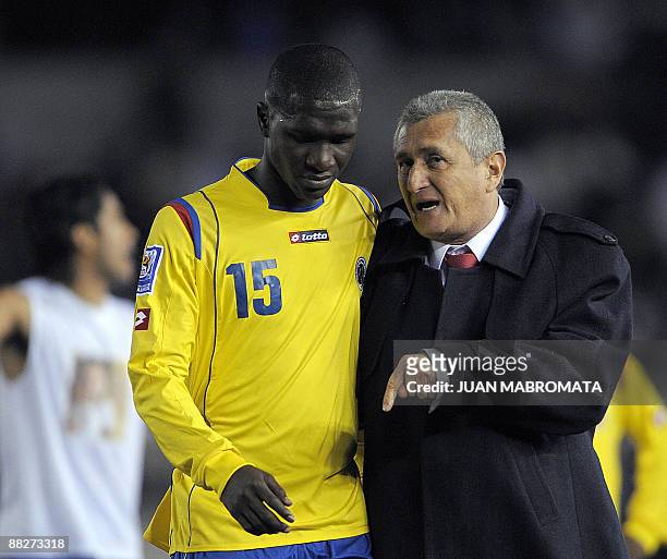 Colombia's coach Eduardo Lara talks to defender Cristian Zapata while leave the field after being defeated by Argentina 1-0 in their FIFA World Cup...