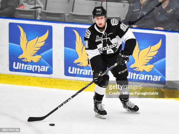 Shaun Miller of the Blainville-Boisbriand Armada looks to play the puck against the Baie-Comeau Drakkar during the QMJHL game at Centre d'Excellence...